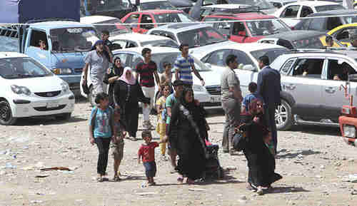 Families in massive traffic jam fleeing Mosul on Tuesday (Reuters)