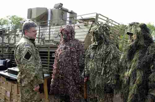 Petro Poroshenko visits the Ukrainian troops last week (AP)