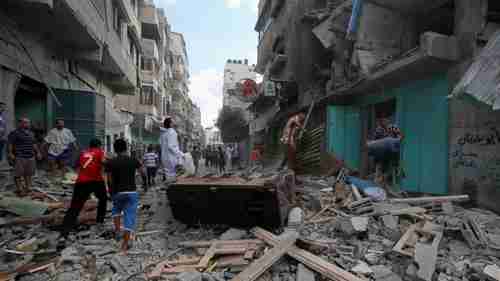 The aftermath of a missile strike in Gaza on Friday (AP)