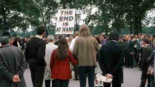 A man with a sign saying THE END IS AT HAND talks to the crowd at Speakers' Corner, Hyde Park, London on 11 June 1972 (BBC)