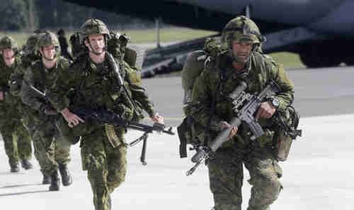 U.S. 173 airborne brigade soldiers leave a C-17 aircraft during the 'Steadfast Javelin II' military exercise in the former Soviet state of Latvia on Saturday (Reuters/MoscowTimes)