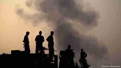 Silhouettes of Israeli soldiers in Gaza, July 12, 2014 (DPA)