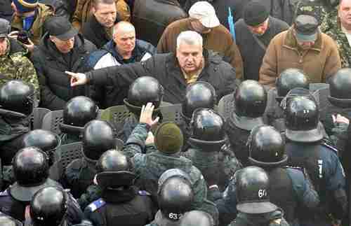 A protester in front of the Ukrainian parliament in Kiev on Tuesday (AFP)