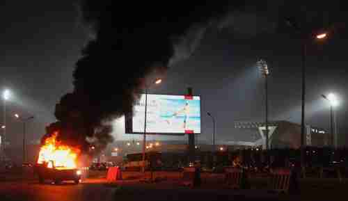 Pickup truck in flames during Sunday's clashes between football fans and police (AP)