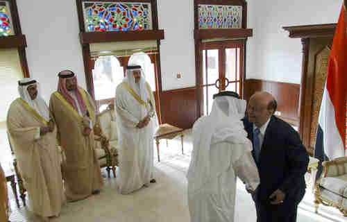 Hadi (in suit) meets Saudi ambassador and entourage (Reuters)