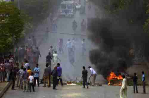 Pakistani Christians block a street during a protest in Karachi on Sunday, following attacks on churches in Lahore. (AFP)