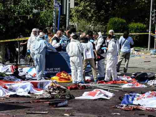 Security forces surrounded by dead bodies on Saturday in Ankara (Getty)