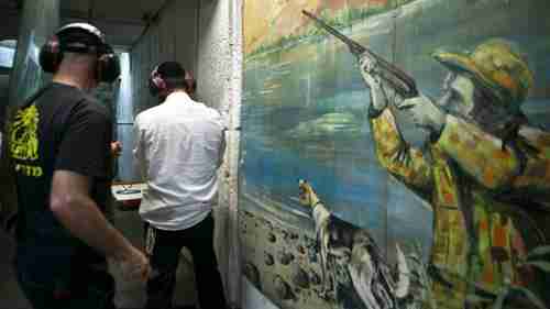 Israelis practicing at a firing range in Tel Aviv last week (Haaretz)