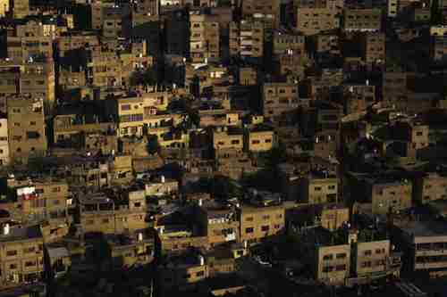 Jabal Al Hussein Refugee Camp in Amman, Jordan. Originally built in 1952 as a refugee camp for Palestinians fleeing conflict from the Arab-Israeli War, it has morphed into a permanent neighborhood in downtown Amman that houses Syrians and Egyptians, along with Palestinians. Many Syrian refugees in Amman live in Jabal Al Hussein Camp because of the affordable rent and to avoid the official refugee camps. (PRI)