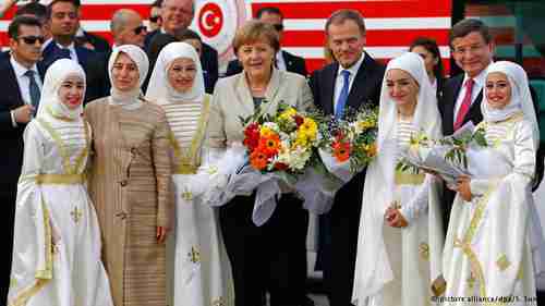 EU and Turkish officials surrounded by hot Muslim chicks at Gaziantep, Turkey, refugee camp on Saturday