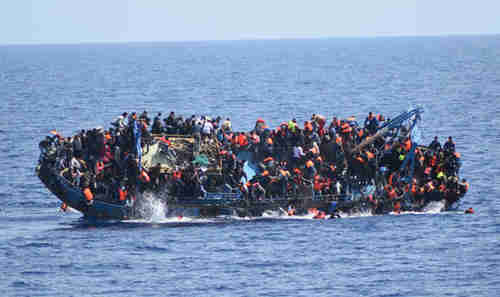 Boat carrying hundreds of migrants capsized on Thursday as an Italian Navy rescue ship approached (Getty)