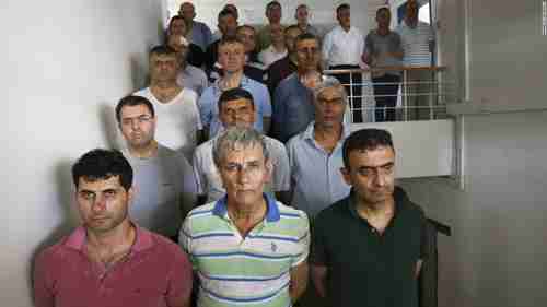 Military officers under arrest after the failed military coup.  Front row center is Akin Ozturk, a four-star general and former commander of the Turkish air force. (CNN)