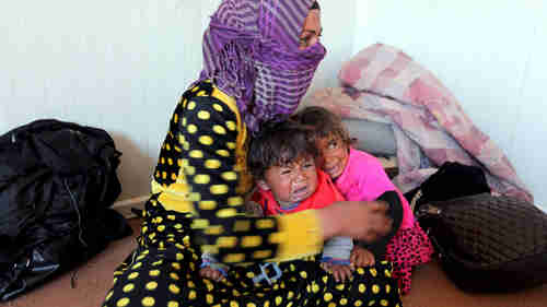 Refugees in a refugee center south of Mosul, February 14, 2016 (Reuters)