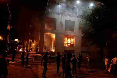 Protesters setting fire to Paraguay's National Congress building in Asuncin on Friday night (Reuters)