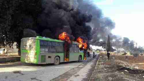 A bus burning during the attack.  The passengers were still in their seats as the bus burned. (ARA News)