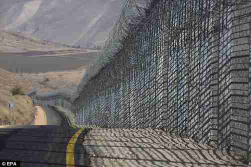 This fence marks the boundary between Syria and the Golan Heights, which Israel annexed in 1981 (EPA)