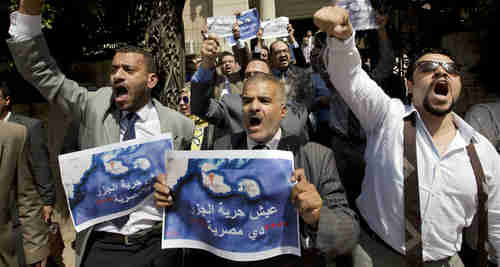 Dozens of Egyptian lawyers shout slogans during a protest in front of the Lawyers' Syndicate in Cairo against the agreement to hand over Tiran and Sanafir to Saudi Arabia.  (AP)