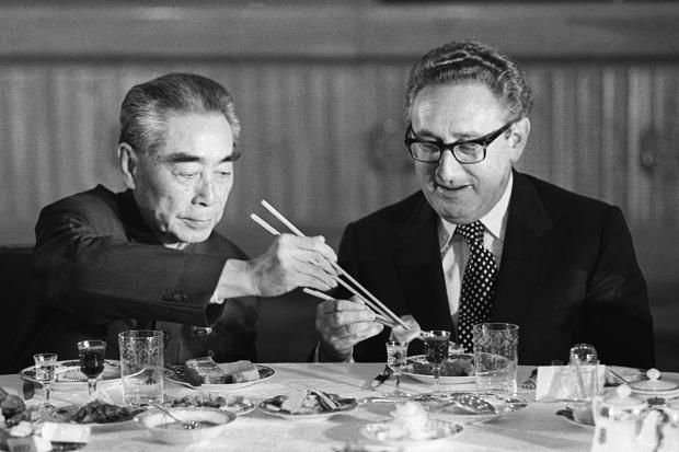 Henry Kissinger shares a meal with Chinese premier Zhou Enlai; Beijing, 1972