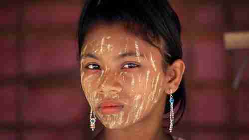 A Rohingya girl in a Bangladesh refugee camp, her face covered in 'thanaka', a comestic makeup paste widely used in the region, made from ground bark (AP)