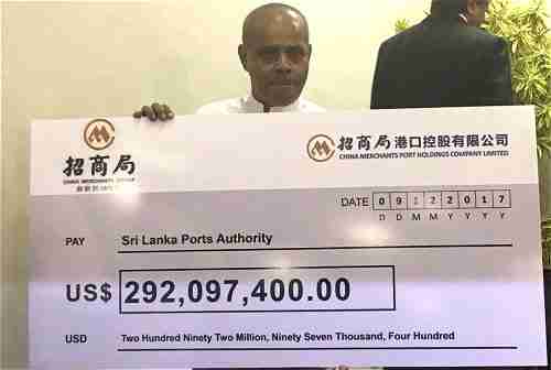 China gives Sri Lanka a check for $292,097,400.00 as the first payment for Hambantota port (Colombo Page)