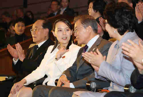 Kim Jong-un's sister Kim Yo-jong speaks with South Korea's president Moon Jae-in during a Seoul theatre performance two weeks ago.  News reports now indicate that Kim Yo-jong was pregnant with her second child.  (Yonhap)