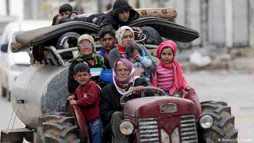 Syrians flee from airstrikes and shelling of village near Afrin (Reuters)