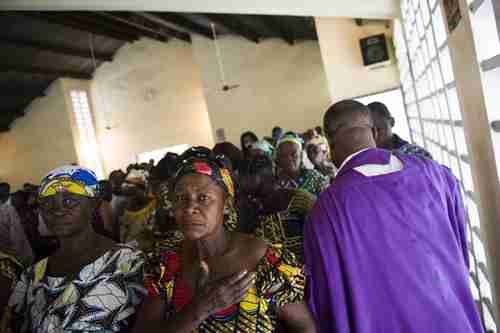  Sunday mass in the St. Christine Catholic Church in DRC's capital city Kinshasa.  (Riva Press / Redux)