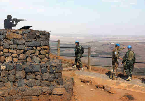 U.N. peacekeepers patrol Mount Bental, an observation post in the Golan Heights near the ceasefire line between Israel and Syria, October 23, 2017.  (Reuters)