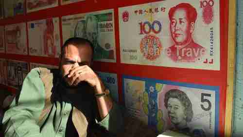 A currency dealer in Quetta, Pakistan (AFP)