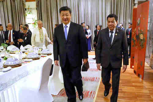 Xi Jinping and rodrigo Duterte meet in Hainan, China, in April 2018 (EPA)