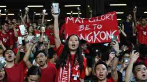 Protesters boo Chinese national anthem and sing 'Glory to Hong Kong' in September 2019 (BBC)