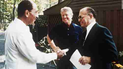 Egypt-Israel peace agreement handshake, on September 6, 1978, at Camp David.  Left to right: Egypt's president Anwar Sadat, US president Jimmy Carter, Israel's prime minister Menachem Begin (CNN)