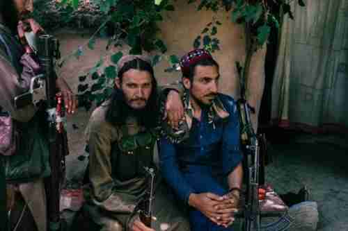 Taliban fighters relax after lunch (Washington Post)