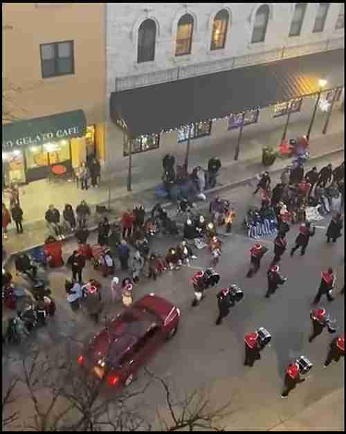 Screen shot from video, just before Brooks' red SUV plows into parade marchers