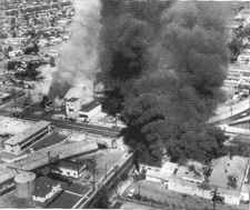 Left: Businesses burning in Watts riot in August, 1965; Right: Car burning in Fallujah riot in April, 2004